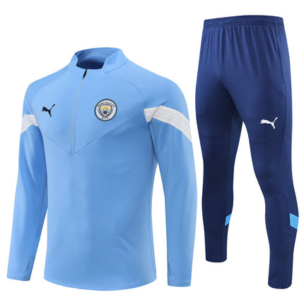 Kit Giacca Blu + Tuta Manchester City 2022/23 (con Taglia Bambino)