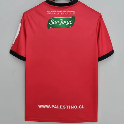 Maglia deportivo palestino allenamento 2022 23 vista posteriore rossa con rifiniture nere e logo san jorge verde