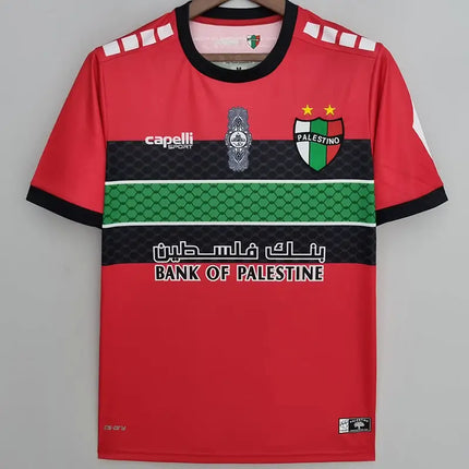 Maglia deportivo palestino allenamento 2022 23 rossa con accenti neri e verdi e logo capelli sport