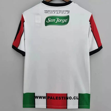 Maglia deportivo palestino home 2022 23 vista posteriore bianca con maniche rosse e nere logo verde e orlo a righe