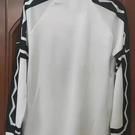 Maglia maniche lunghe colo-colo home retro 1995 96 bianca con motivi geometrici neri su spalle e maniche