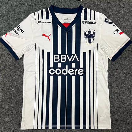 Maglia monterrey home 2022 23 con righe verticali bianche e blu navy, collo a v e sponsor bbva codere, firmata puma