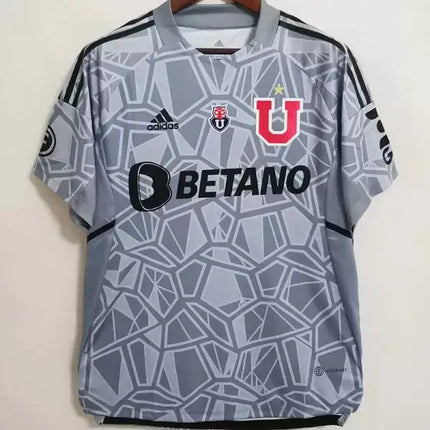 Maglia portiere universidad de chile 2022 23 grigia con motivo geometrico e logo rosso u sul petto