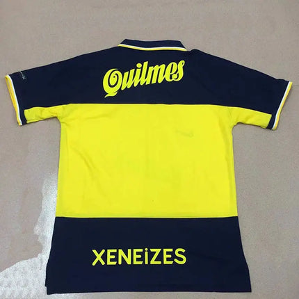Maglia retro boca juniors home 1998/99 in navy blue e giallo con scritte neon verde quilmes e xeneizes sul retro