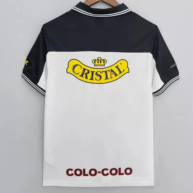 Maglia retro colo-colo home 1999/00 polo bianca e nera con logo cristall giallo con corona e scritta colo-colo bordeaux