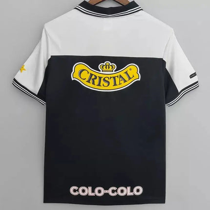 Maglia retro colo-colo trasferta 1999/00 nera e bianca con logo cristale giallo a maniche corte in tessuto tecnico