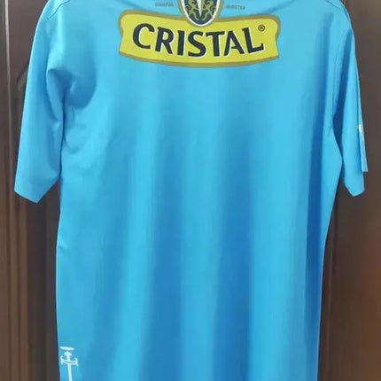 Retro maglia universidad catolica blu maniche corte con logo sponsor cristal giallo sul retro edizione commemorativa 2011/12