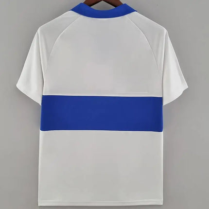 Maglia retro Universidad Catolica home 1993 94 bianca in tessuto tecnico con banda orizzontale blu e collo blu