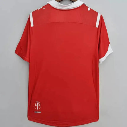 Maglia retro universidad catolica trasferta 2009 10 in tessuto puma rosso con bordi bianchi su collo maniche e spalle