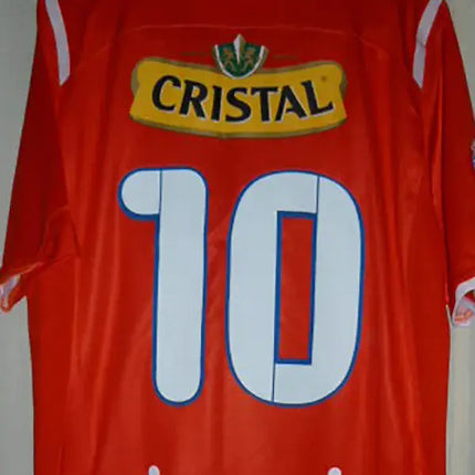 Maglia retro universidad catolica trasferta 2009 10 rosso con numero 10 bianco e blu sponsor cristal giallo e mirosevic bianco sul retro