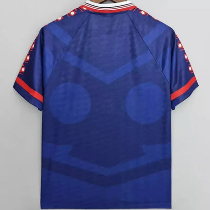Maglia retro universidad de chile home 1996 97 blu con maniche corte bordo rosso e bianco volto stilizzato in diverse tonalità di blu