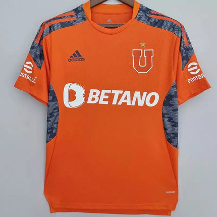 Maglia universidad de chile allenamento 2022 23 arancione adidas con pannelli mimetici blu navy e logo u bianco con stella