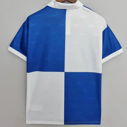 Polo a quadri blu e bianco con motivi discreti di uccelli terza maglia retro universidad catolica 1998 99